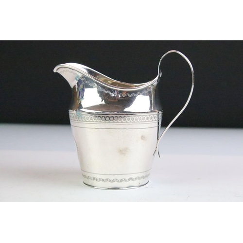 138 - George III silver milk / cream jug with bright cut banding decoration and high loop reeded handle, h... 