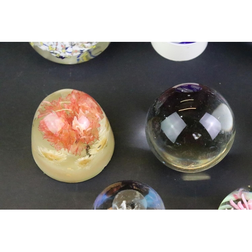 151 - Collection of 20th century paperweights of varying size & colour, featuring floral examples