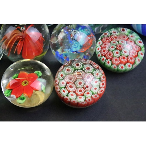 153 - 32 Glass paperweights, some with butterflies, swans, various colours & sizes