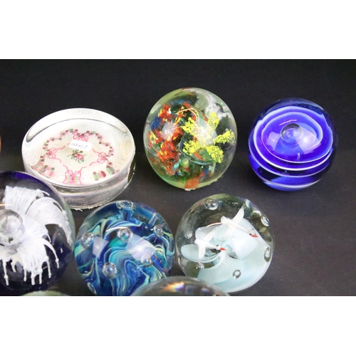 153 - 32 Glass paperweights, some with butterflies, swans, various colours & sizes