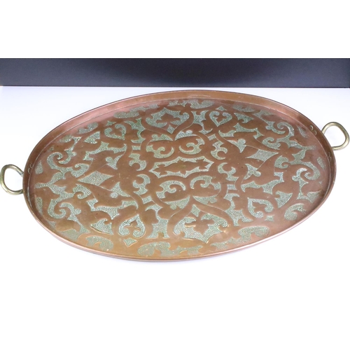 186 - Early 20th Century hammered copper tray having stylised hammered detailing to tray and twin brass ha... 