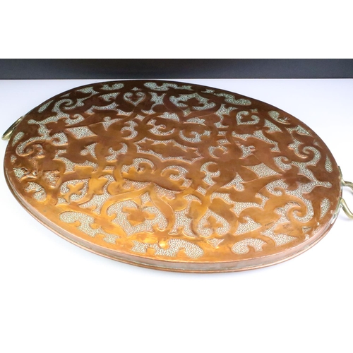 186 - Early 20th Century hammered copper tray having stylised hammered detailing to tray and twin brass ha... 