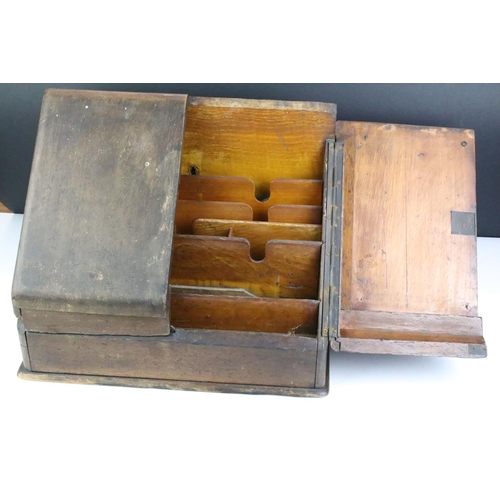 189 - Early 20th Century oak cased desk tidy having a pair of sloped twin doors with sectional interior. M... 