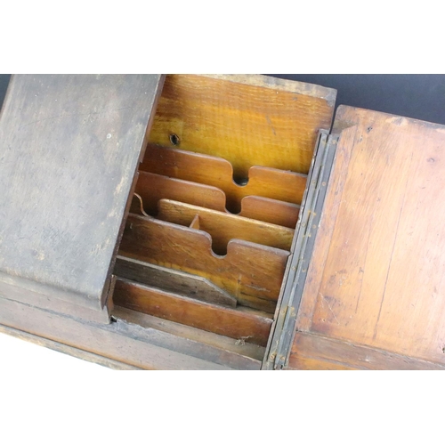 189 - Early 20th Century oak cased desk tidy having a pair of sloped twin doors with sectional interior. M... 