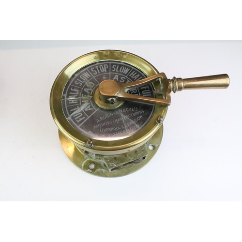 190 - Early 20th Century A Robinson & Co brass cased ships telegraph together with a Smiths Empire brass c... 