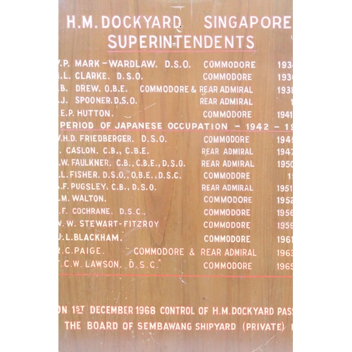 581 - H M Dockyard Singapore 1930s commodore board with painted lettering. Measures 69 x 56cm.