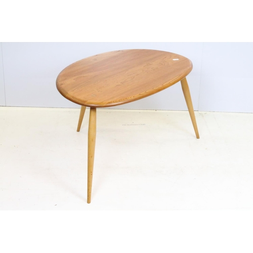 705 - Ercol elm pebble nest of tables each having oval tops raised on tapering turned legs. Ercol sticker ... 