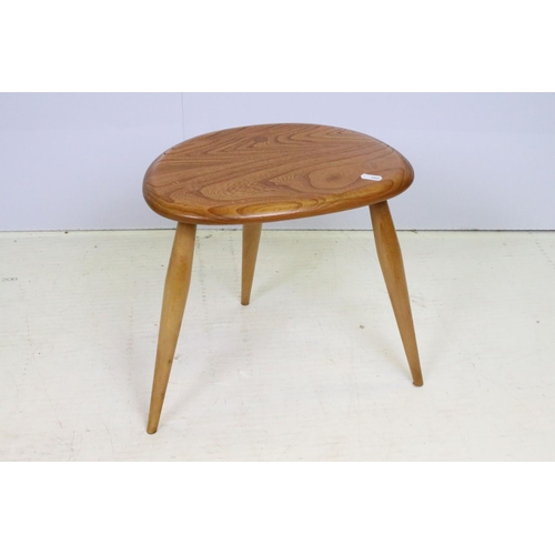 705 - Ercol elm pebble nest of tables each having oval tops raised on tapering turned legs. Ercol sticker ... 