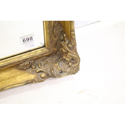 698 - Large gilt framed bevelled edged rectangular wall mirror with scroll detail, approx 104cm W x 75cm H