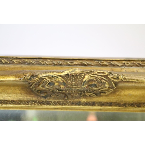 698 - Large gilt framed bevelled edged rectangular wall mirror with scroll detail, approx 104cm W x 75cm H