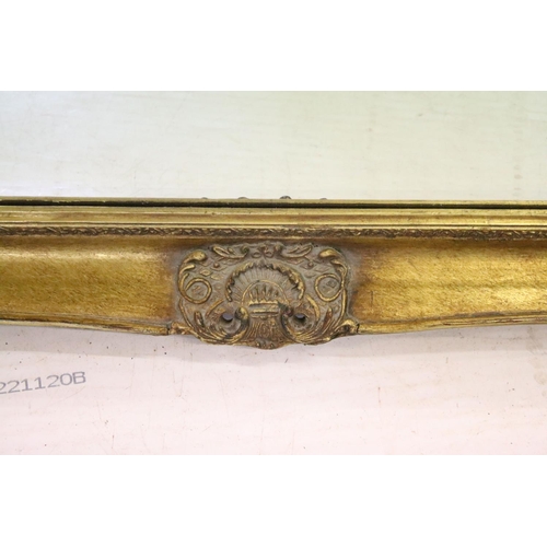 698 - Large gilt framed bevelled edged rectangular wall mirror with scroll detail, approx 104cm W x 75cm H