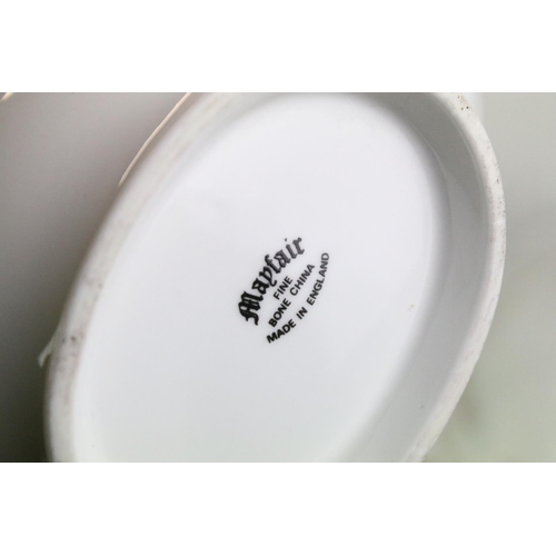 141 - Mayfair ceramic dinner service having a white ground with pink floral details to include lidded dish... 