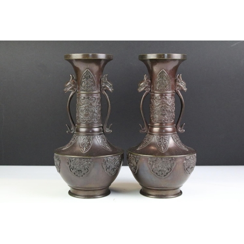 212 - Pair of Chinese Bronze Vases, the twin handles in the form of mythical beast heads, 24cm high