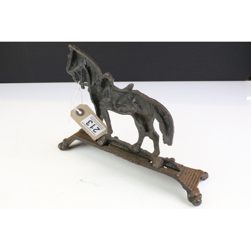 213 - 19th Century Victorian cast iron door stop in the form of a Boer War horse raised on a stepped base.... 