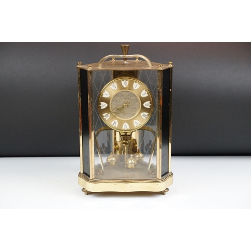 162 - 20th century brass anniversary mantel clock with ball pendulum, the dial marked 'ZAL', housed within... 