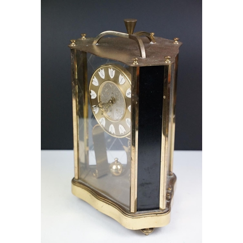 162 - 20th century brass anniversary mantel clock with ball pendulum, the dial marked 'ZAL', housed within... 