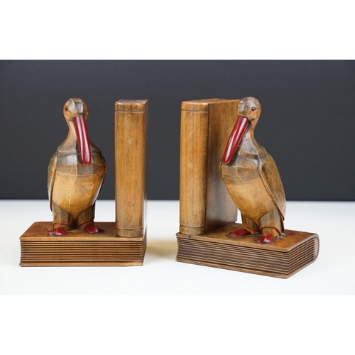 163 - Pair of Art Deco carved oak bookend modelled as birds, with cherry Bakelite details, approx 15cm tal... 