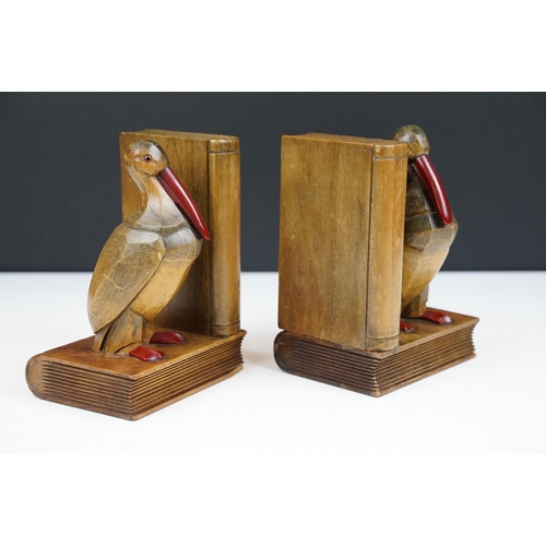 163 - Pair of Art Deco carved oak bookend modelled as birds, with cherry Bakelite details, approx 15cm tal... 