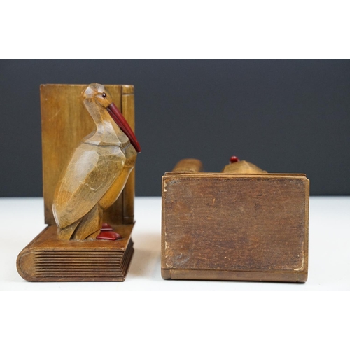 163 - Pair of Art Deco carved oak bookend modelled as birds, with cherry Bakelite details, approx 15cm tal... 