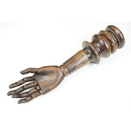 168 - Artist model hand with articulated fingers, raised on a turned wooden base, approx 44cm high