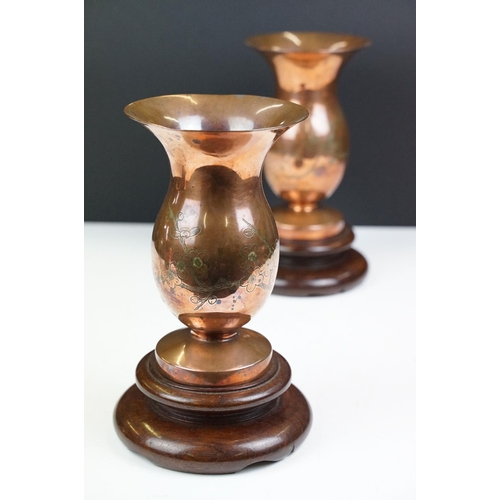 169 - Pair of Chinese Bronze Vases with prunus blossom engraving, raised on wooden stands, 22cm high