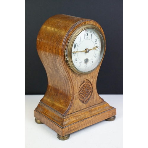 174 - Edwardian balloon oak mantel clock with white enamel dial and carved detail, approx 22.5cm high