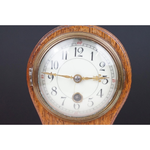 174 - Edwardian balloon oak mantel clock with white enamel dial and carved detail, approx 22.5cm high