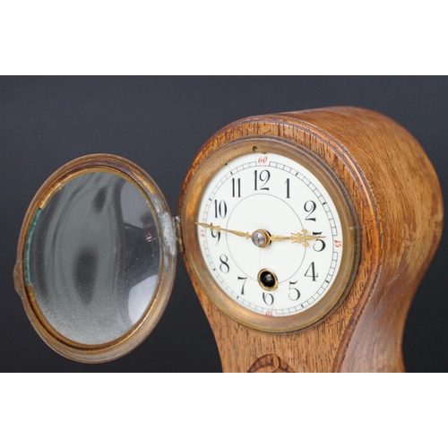 174 - Edwardian balloon oak mantel clock with white enamel dial and carved detail, approx 22.5cm high