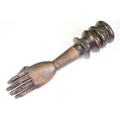 174A - Artist model hand with articulated fingers, raised on a turned wooden base, approx 44cm high