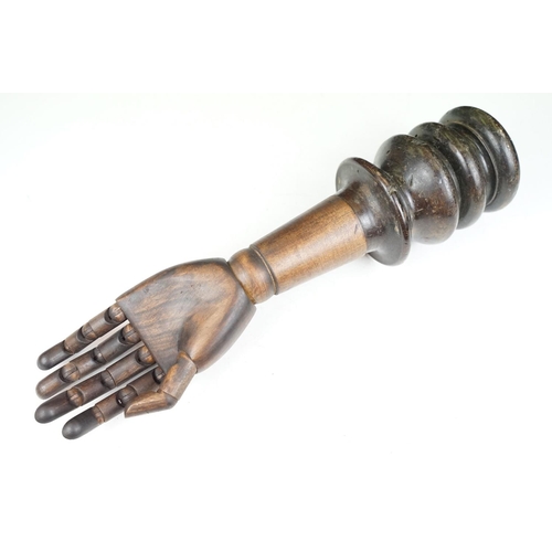 174A - Artist model hand with articulated fingers, raised on a turned wooden base, approx 44cm high