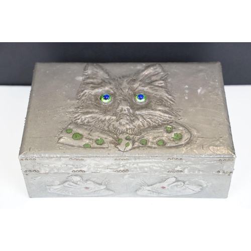 179 - Arts and Crafts Pewter embossed Box, the hinged lid decorated with cat wearing a bow tie with irides... 