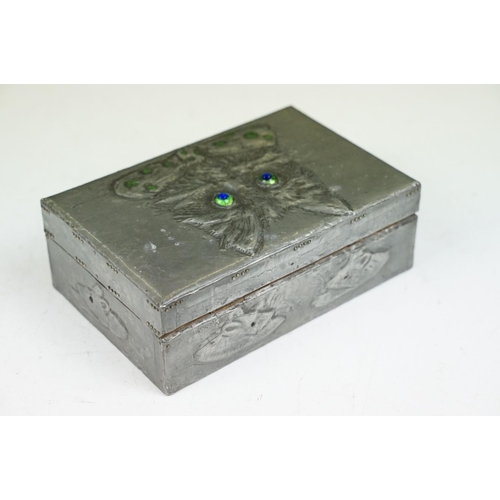 179 - Arts and Crafts Pewter embossed Box, the hinged lid decorated with cat wearing a bow tie with irides... 