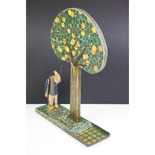 180 - Early 20th century French wooden folk art fruit catching game, the figure with articulated arm. (Mea... 