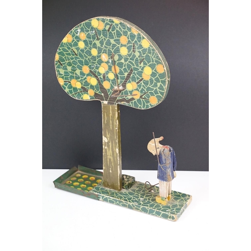 180 - Early 20th century French wooden folk art fruit catching game, the figure with articulated arm. (Mea... 