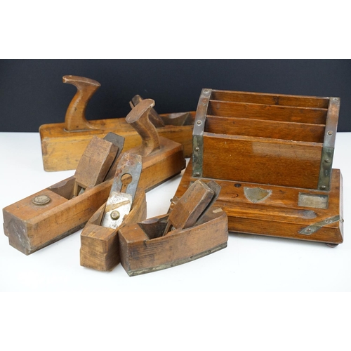 567 - Four woodworking planes to include two H J Matthews examples together with an early 20th Century oak... 