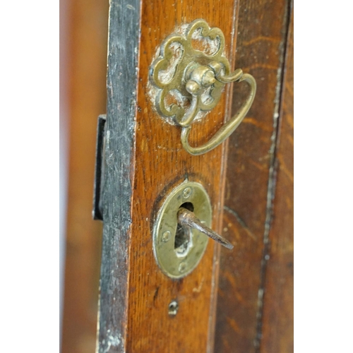 697 - Georgian oak corner cupboard, with dentil cornice above panelled door with parquetry geometric star ... 