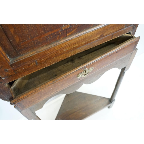 697 - Georgian oak corner cupboard, with dentil cornice above panelled door with parquetry geometric star ... 