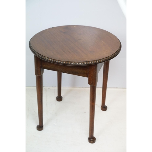 702 - Early 20th Century oak side table having a round top with reeded rim and turned legs. Measures 51 x ... 