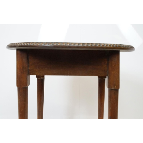 702 - Early 20th Century oak side table having a round top with reeded rim and turned legs. Measures 51 x ... 