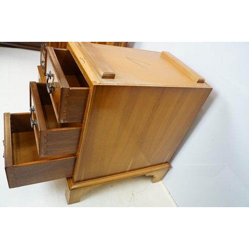 704 - 20th Century walnut veneered twin pedestal desk having a green leather top with three drawers to des... 