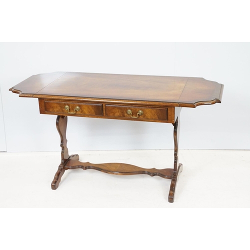 696 - 20th Century mahogany occasional coffee / side table having a shaped top with twin drawers beneath e... 