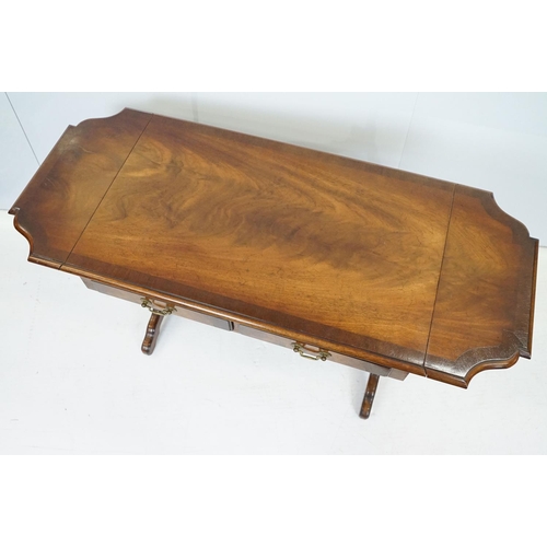 696 - 20th Century mahogany occasional coffee / side table having a shaped top with twin drawers beneath e... 