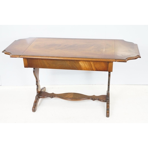 696 - 20th Century mahogany occasional coffee / side table having a shaped top with twin drawers beneath e... 