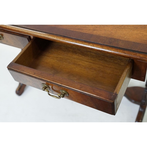 696 - 20th Century mahogany occasional coffee / side table having a shaped top with twin drawers beneath e... 