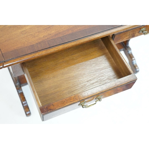 696 - 20th Century mahogany occasional coffee / side table having a shaped top with twin drawers beneath e... 