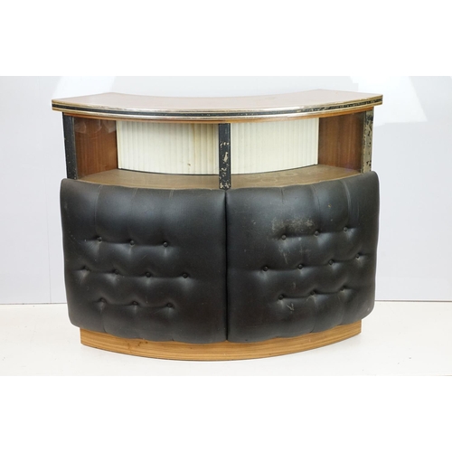 810 - Mid 20th century curved bar with glass windows above the buttoned cushioned front, with sliding door... 