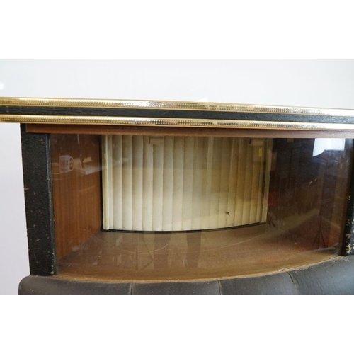 810 - Mid 20th century curved bar with glass windows above the buttoned cushioned front, with sliding door... 