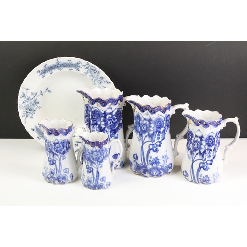 101 - Set of five Ironstone blue & white graduating jugs with gilt details, plus a 19th century W.H. Grind... 