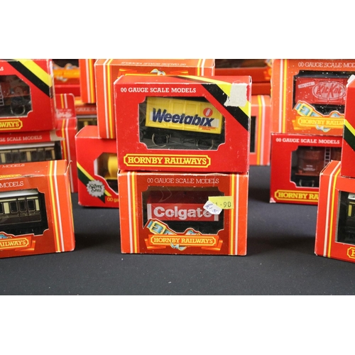 130 - 41 Boxed Hornby OO gauge items of rolling stock to include coaches, vans and wagons featuring R413 O... 