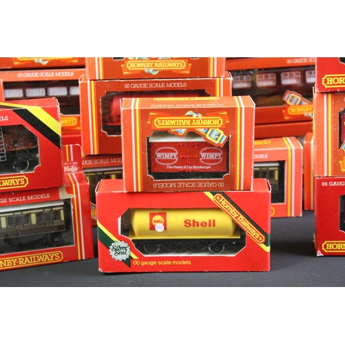 130 - 41 Boxed Hornby OO gauge items of rolling stock to include coaches, vans and wagons featuring R413 O... 